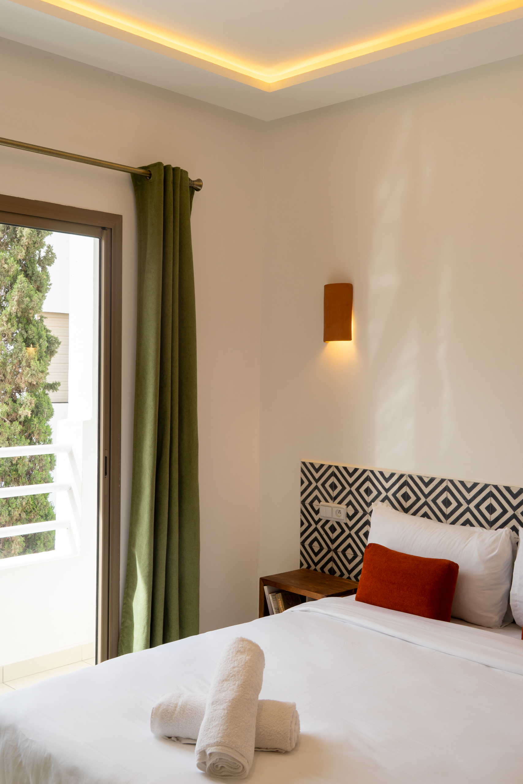 Close-up of the cozy outdoor seating area on a private balcony, perfect for a quiet morning coffee.